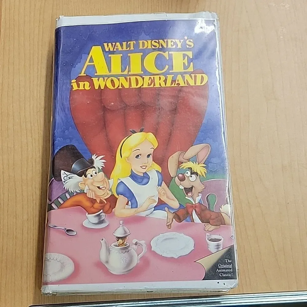 Alice in Wonderland 1 vhs 1 dvd movie, 1 book, Happy‎ Meal Toy, Stickers, Pin